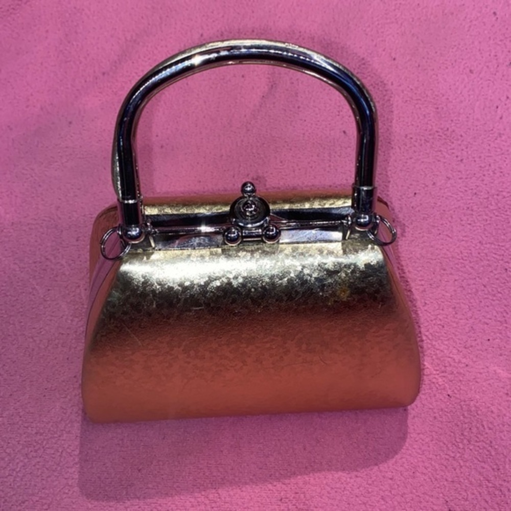 Brand new no tags , small Gold Hardshell mini Purse small zipper inside handle
